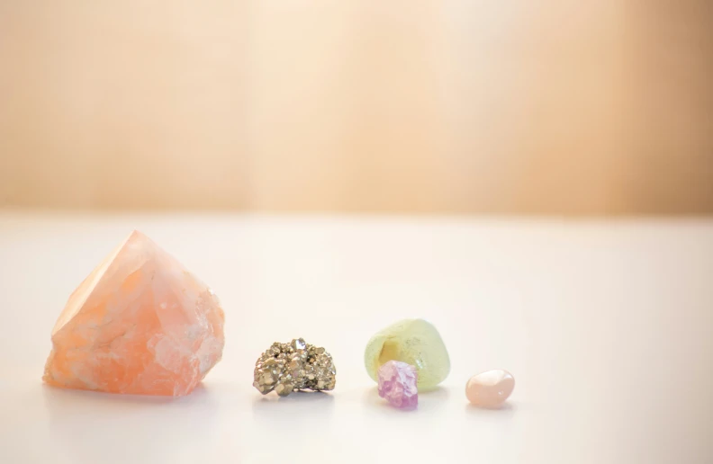 three different sized jewels are sitting on a table