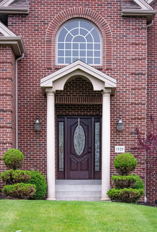 a doorway to an entry way at a brick building