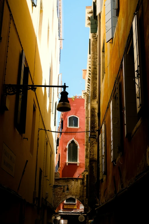 the back alley has many narrow buildings with large windows