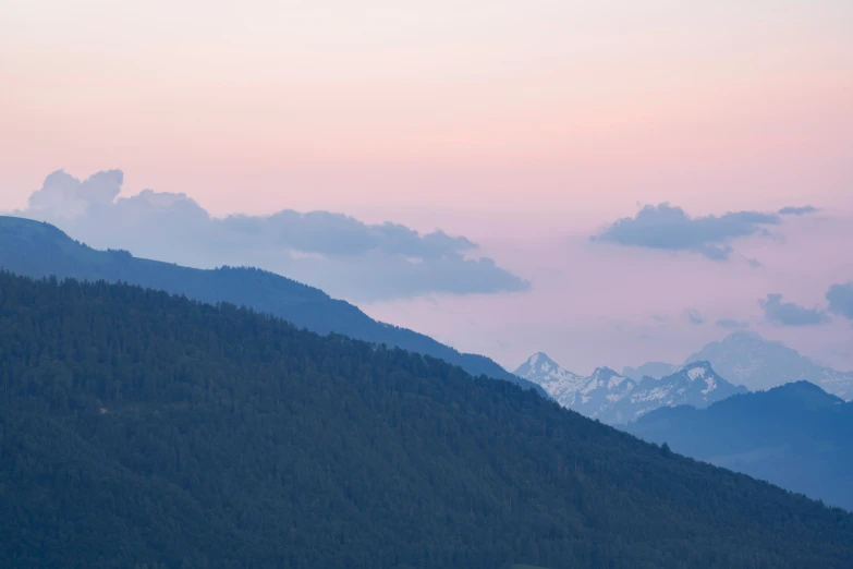 the mountain landscape shows a beautiful sky and some clouds