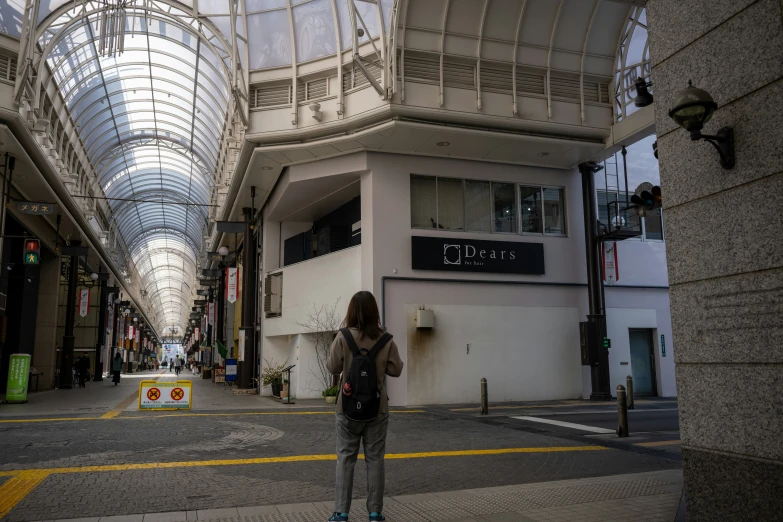 a young woman skates on an empty shopping street