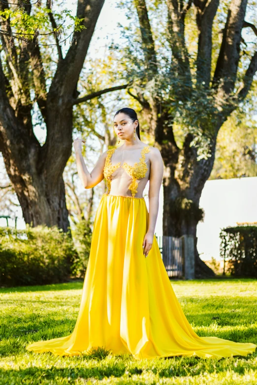 a woman is wearing a bright yellow skirt