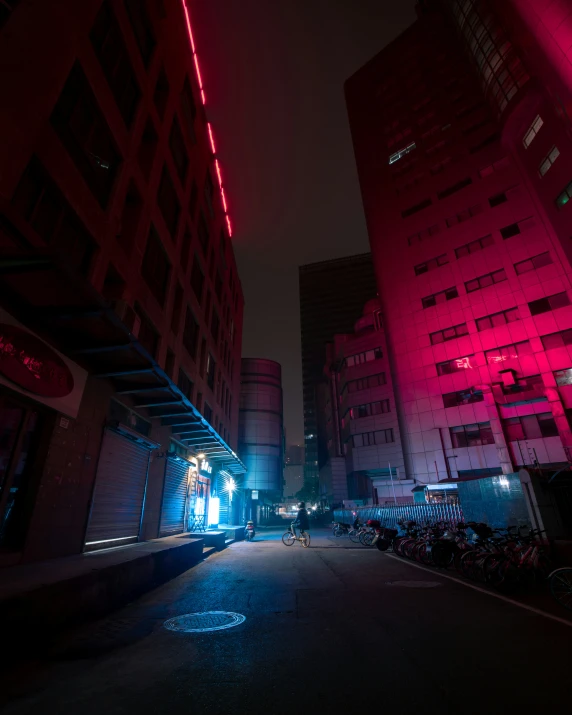 a building next to a street at night