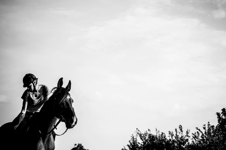 a person in the air on a horse