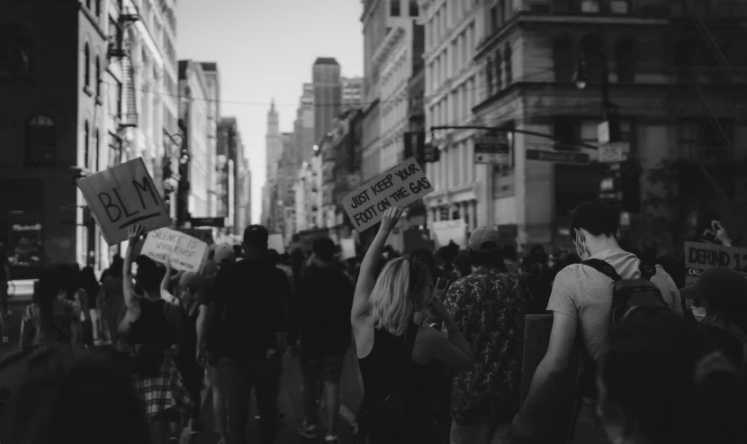 several people walking through a crowded city street