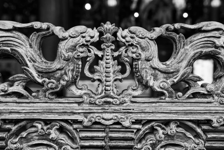 black and white picture of an old wooden carving