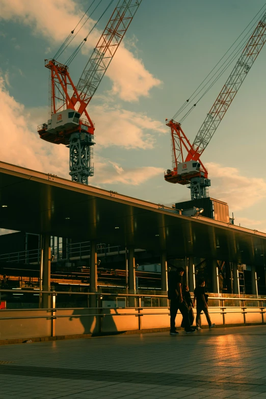 construction cranes are seen above the station under construction