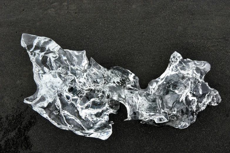 an ice - crystalsed substance is seen against a black background