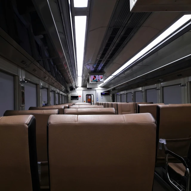 empty seats sit in rows on a train