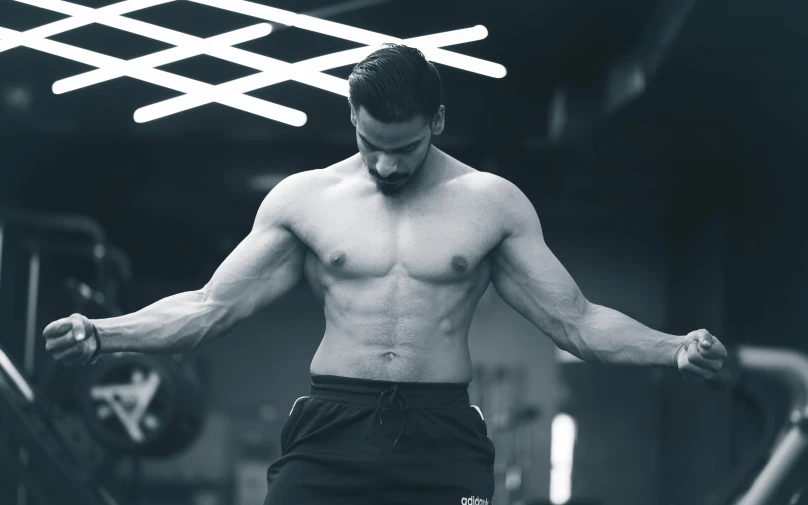 a man in the middle of doing exercise at a gym