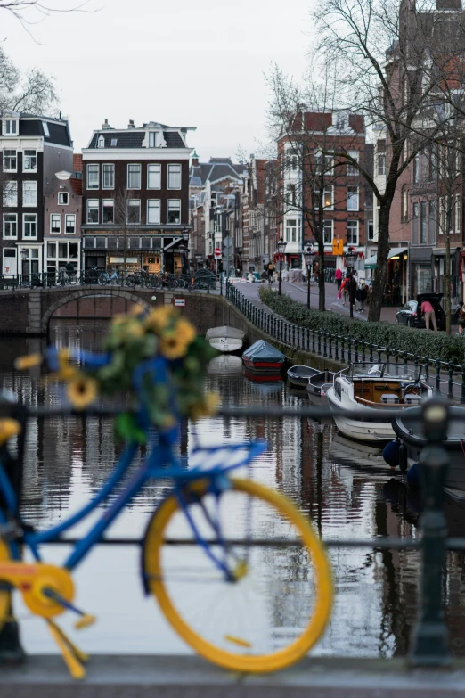 a bike parked in front of a canal