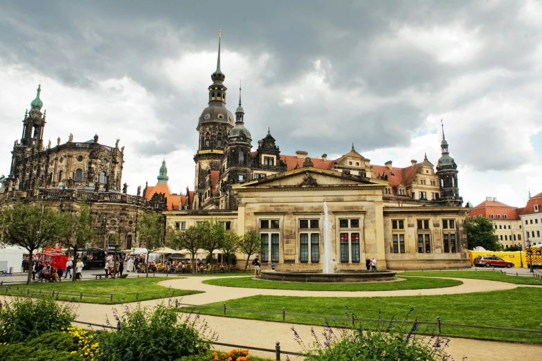 a large building that has some fountain in front