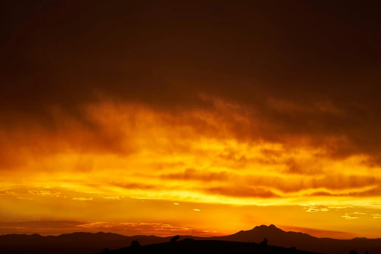 a sky with many clouds and a red yellow and purple color