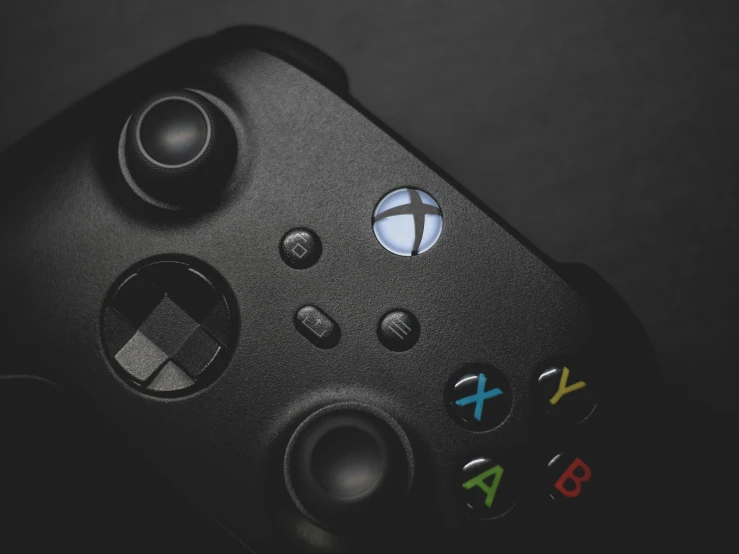 closeup of a game controller with an x and y logo on it