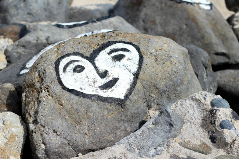 some rock with a heart drawn on it