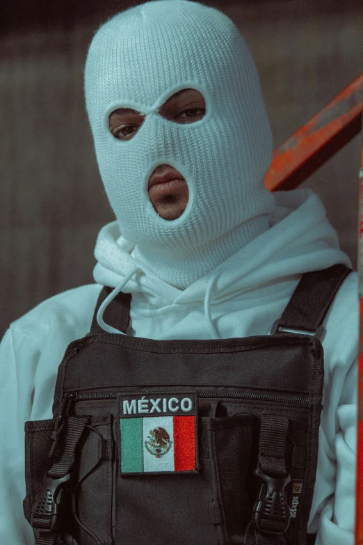 a man with a mexican flag on his face