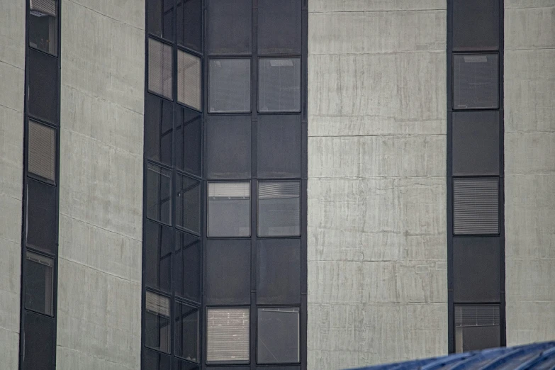 a very tall building with a black and blue umbrella