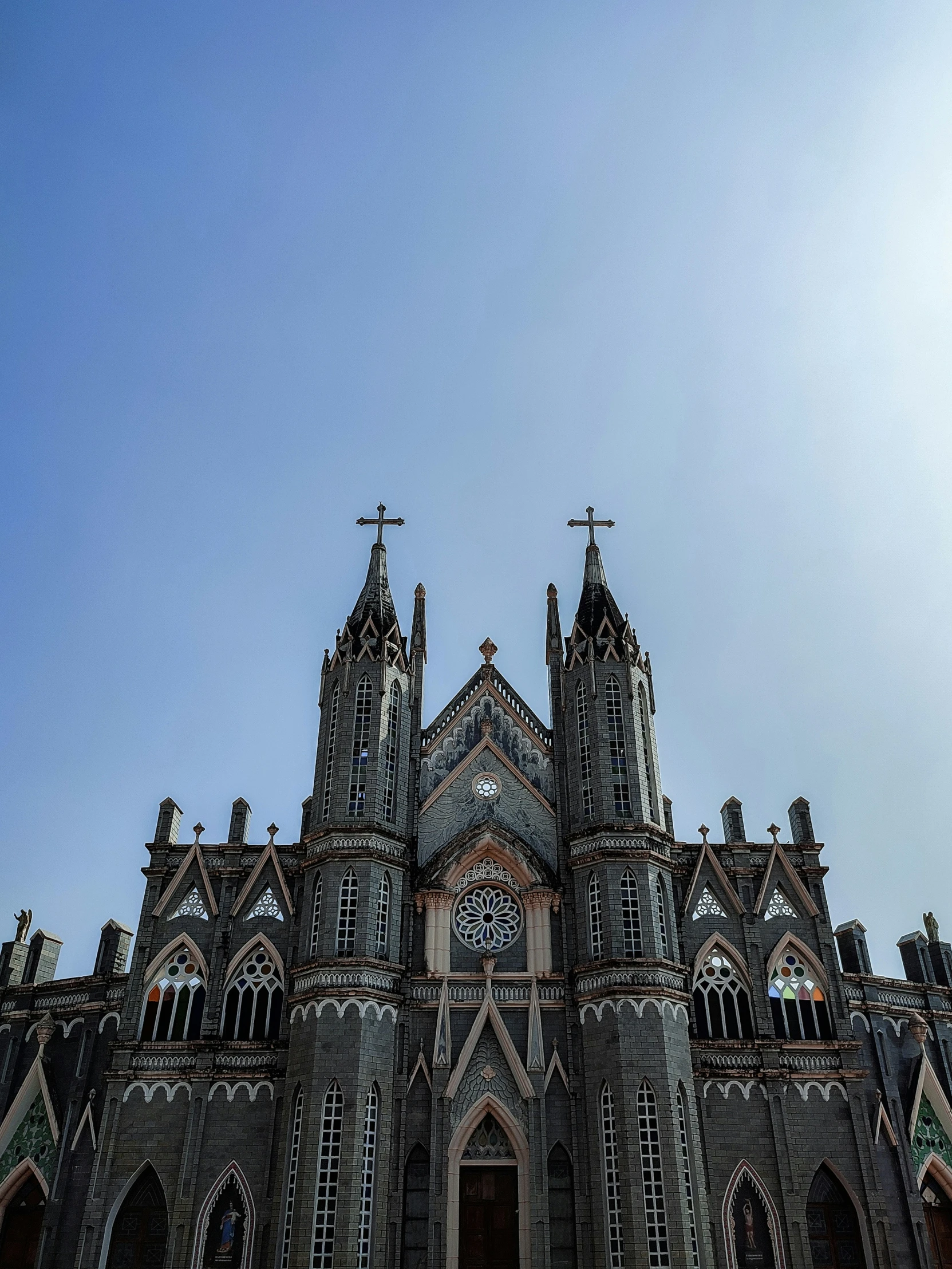 an ornate stone building with stained glass windows