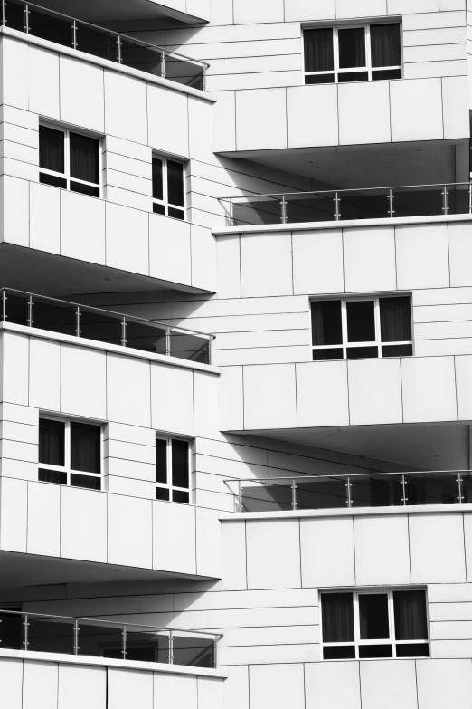 a black and white po of a building with balconies