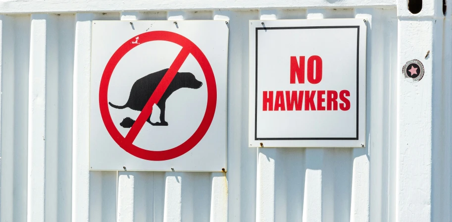 no hakkers and no no monkeys sign on the side of a building