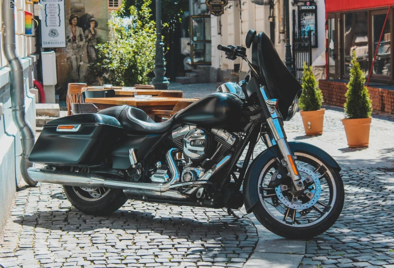 a motorcycle is parked outside on the side walk