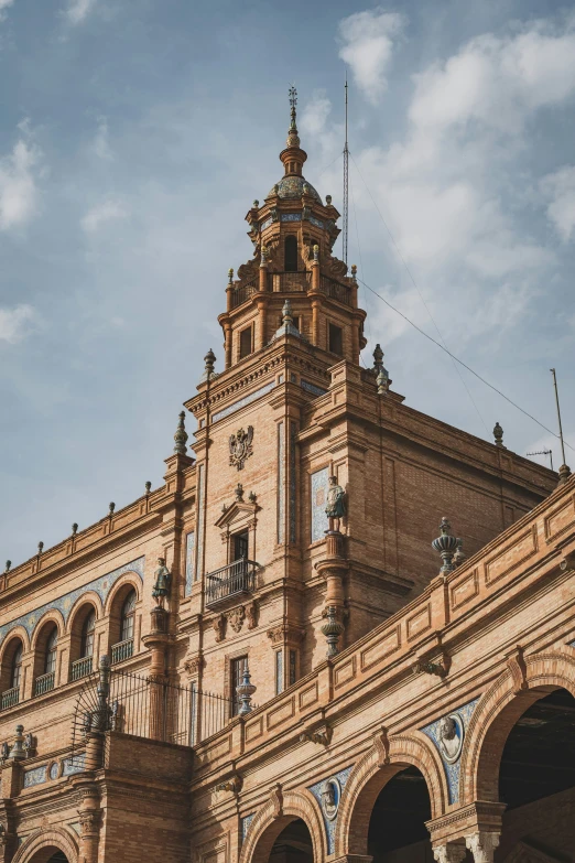 an old clock tower sits atop a brick building