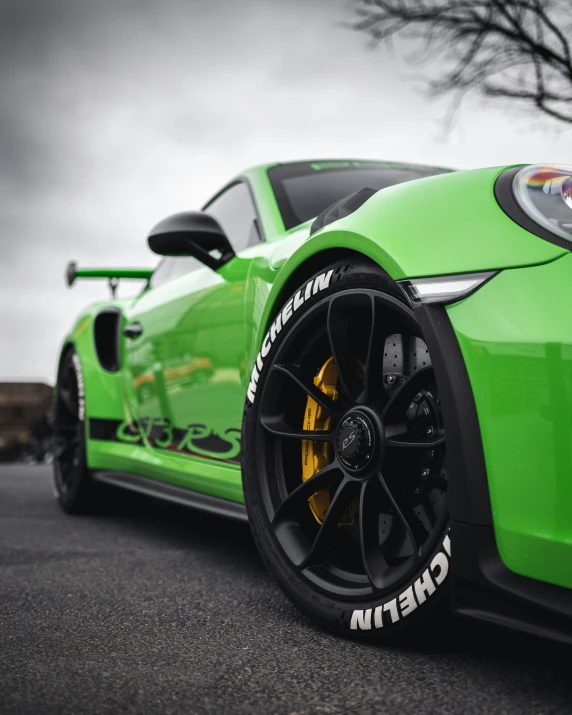 the tire cover of a car painted bright green