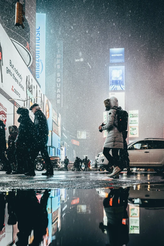 a group of people walk through a snow storm