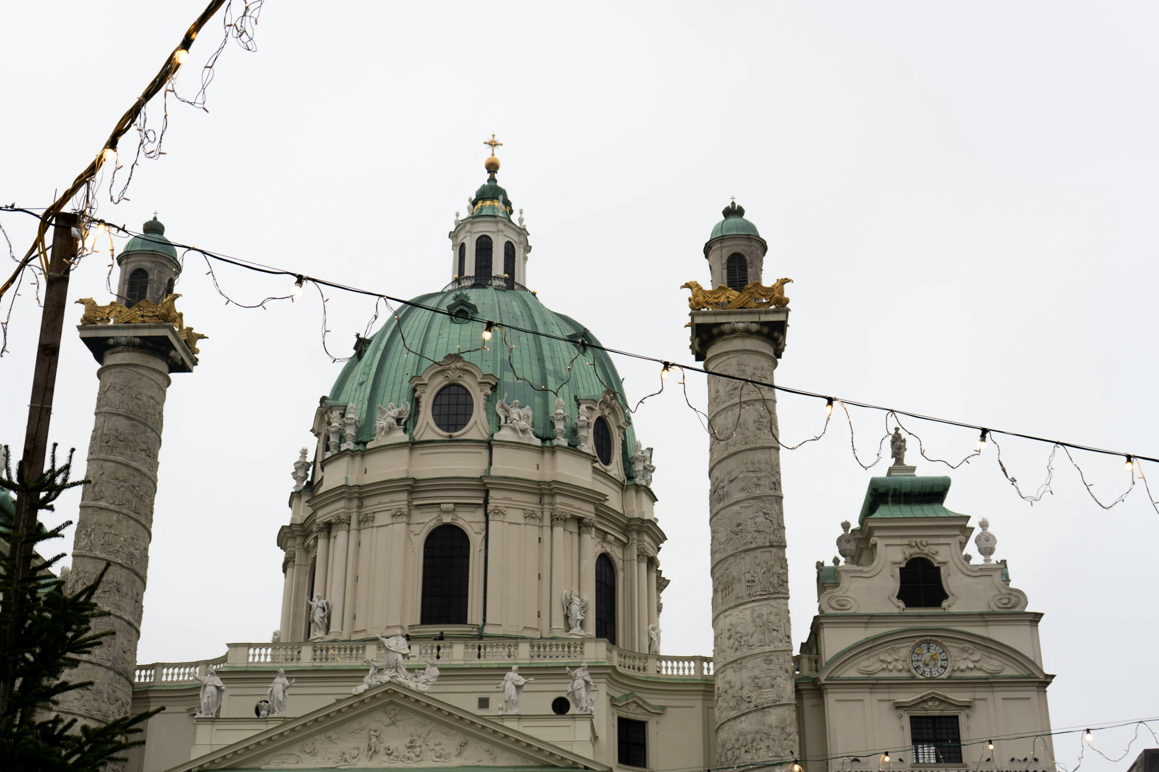 the towers on the building are adorned with lights