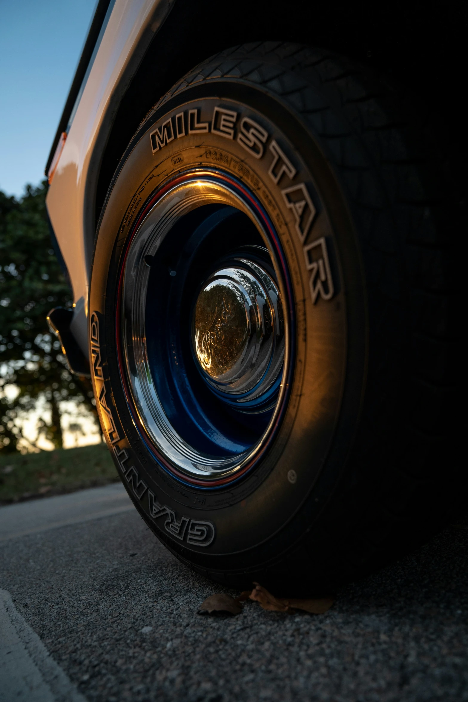 an older tire that is sitting on the ground