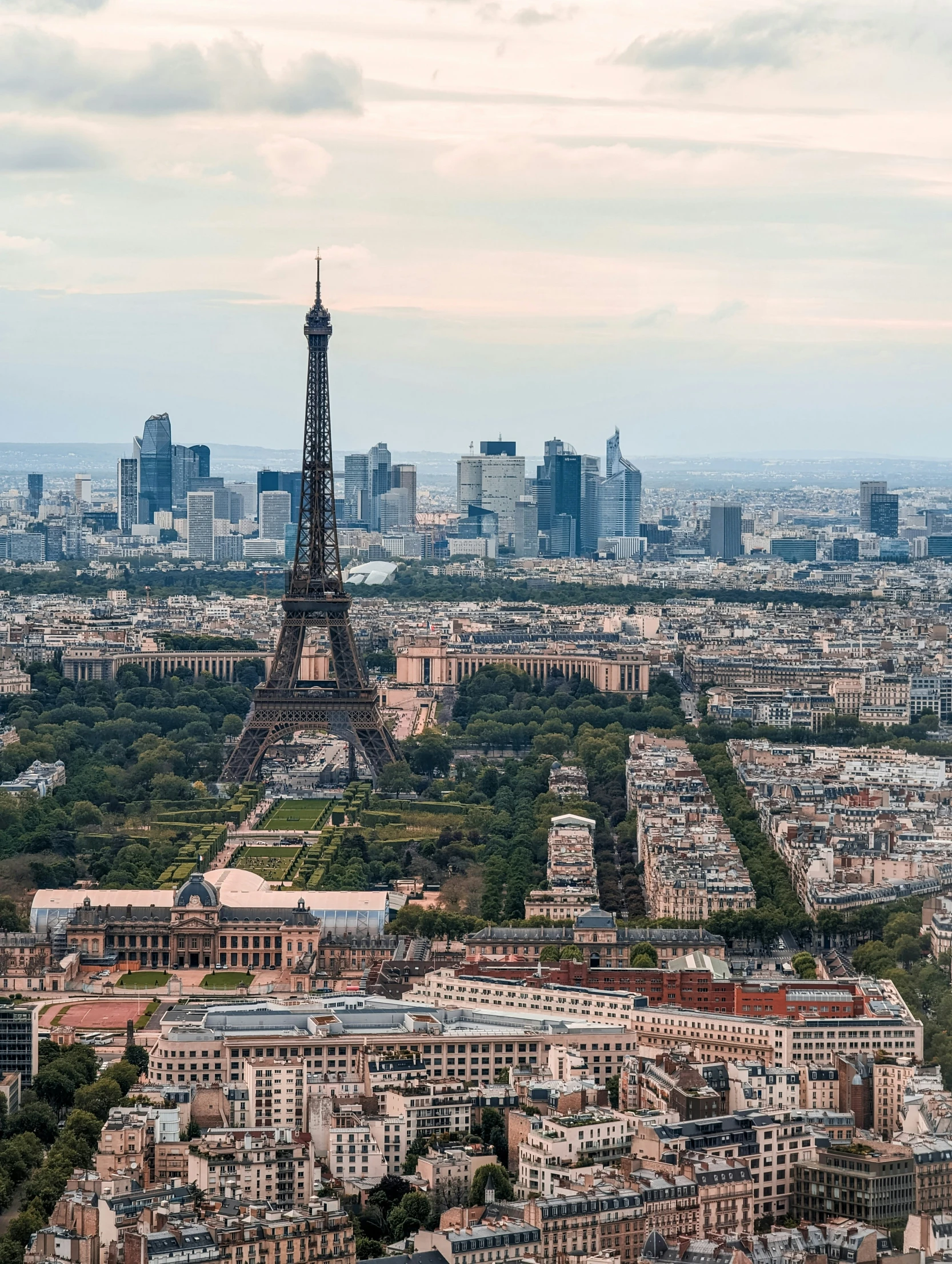 view of city skyline of paris with the eiffel tower in the distance