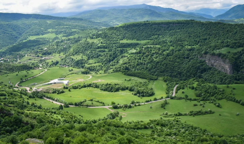 a view of green hills, valleys and valleys