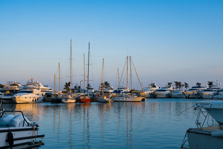 boats are parked in the water, the ocean is filled with small vessels