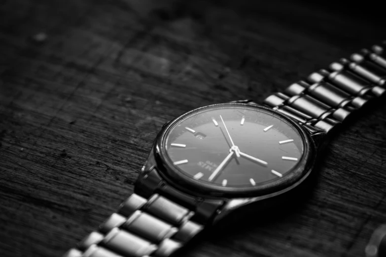 a close up view of a watch laying on a table