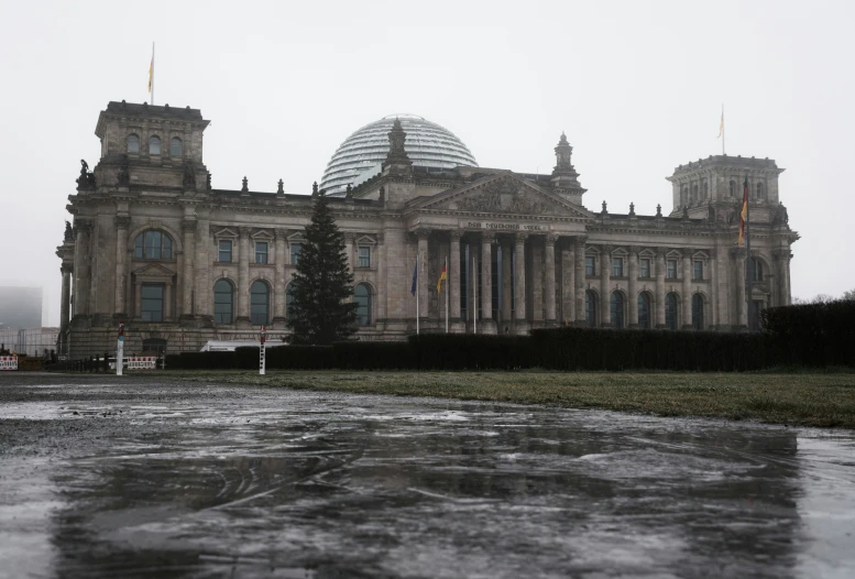 a large building sitting on top of a snow covered field