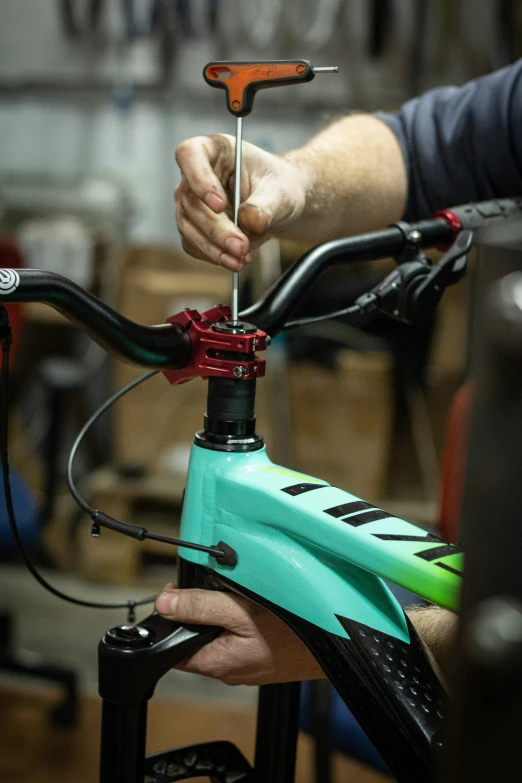 a person adjusting the handle of a bike