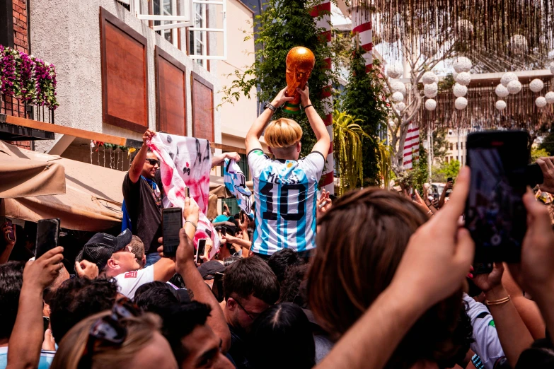 an image of a group of people holding up bottles