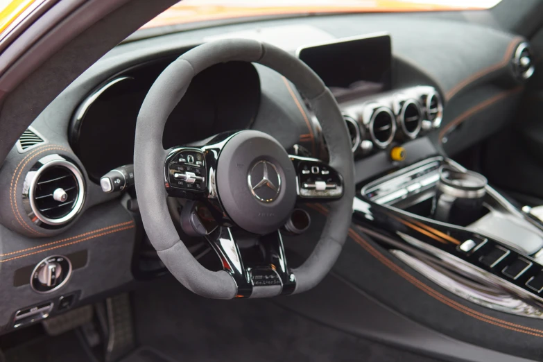 a steering wheel in a mercedes sports car