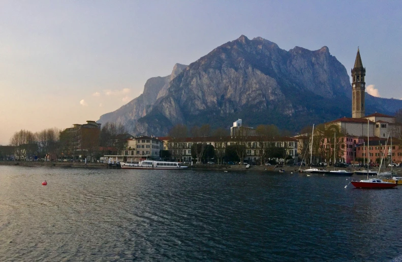 the town and mountains is on an almost empty lake