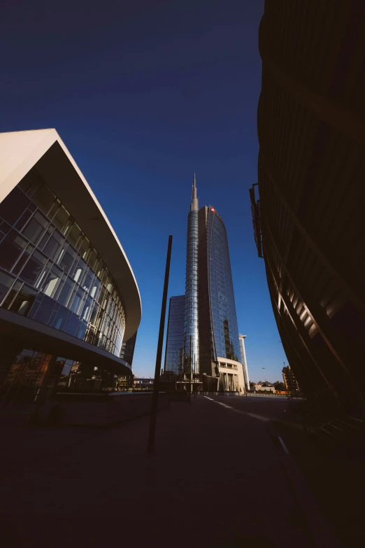 some tall buildings against a blue sky