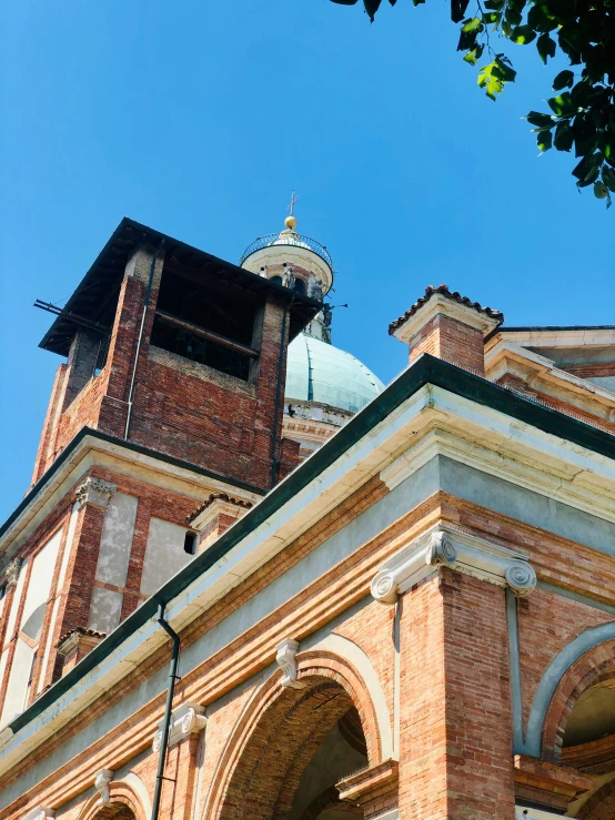 an ornate building with a steeple and a roof