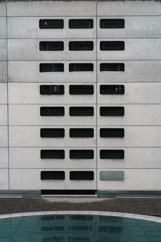 a stop sign in front of a concrete building