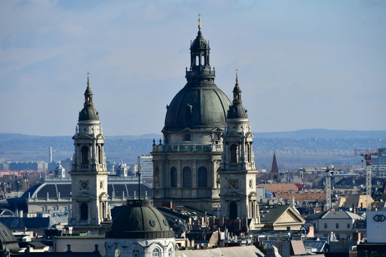 a tall clock tower sitting above a city