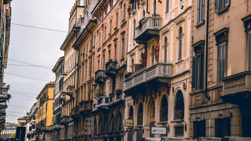 there are many different colored buildings lining this street