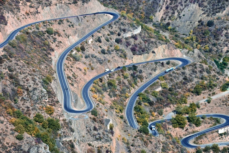 there are several roads that curves on a mountain