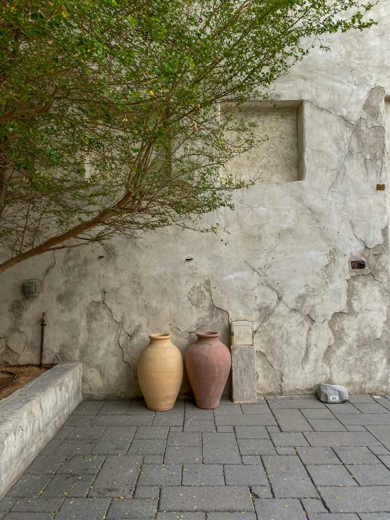 the three jars are sitting on the curb