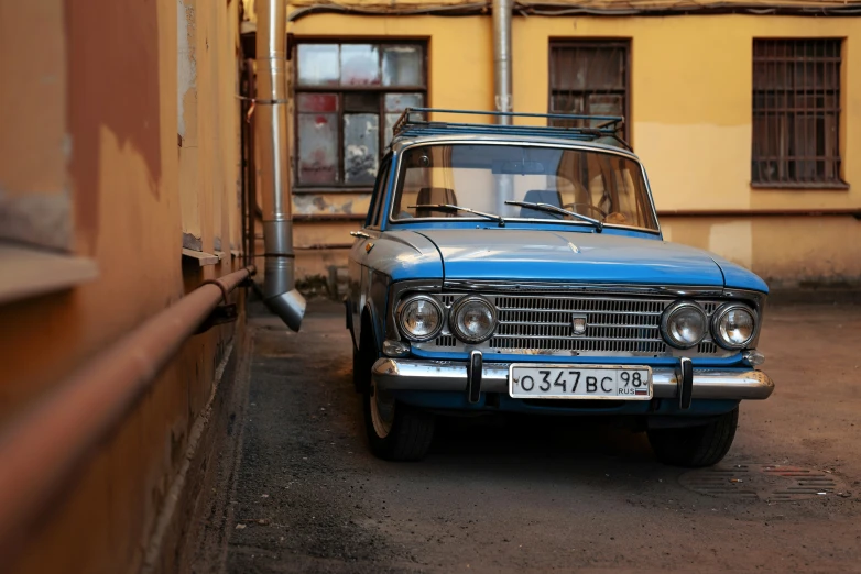 an old station wagon sits in a parking lot