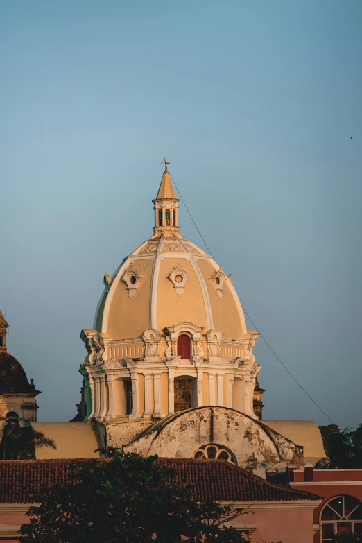 a very large dome type building with a clock tower