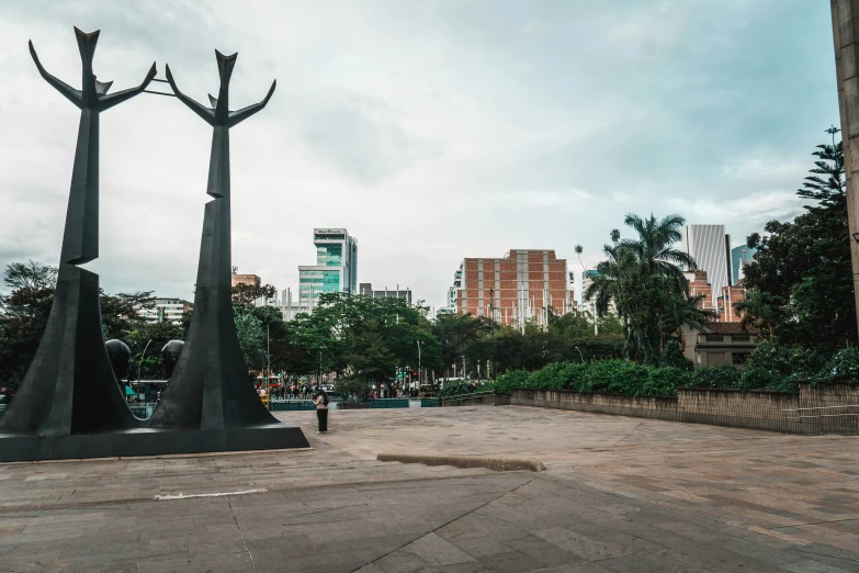 this is a park with three sculptures on the sides