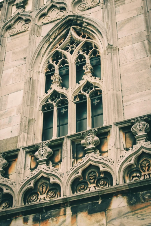 large cathedral window with ornate windowwork above